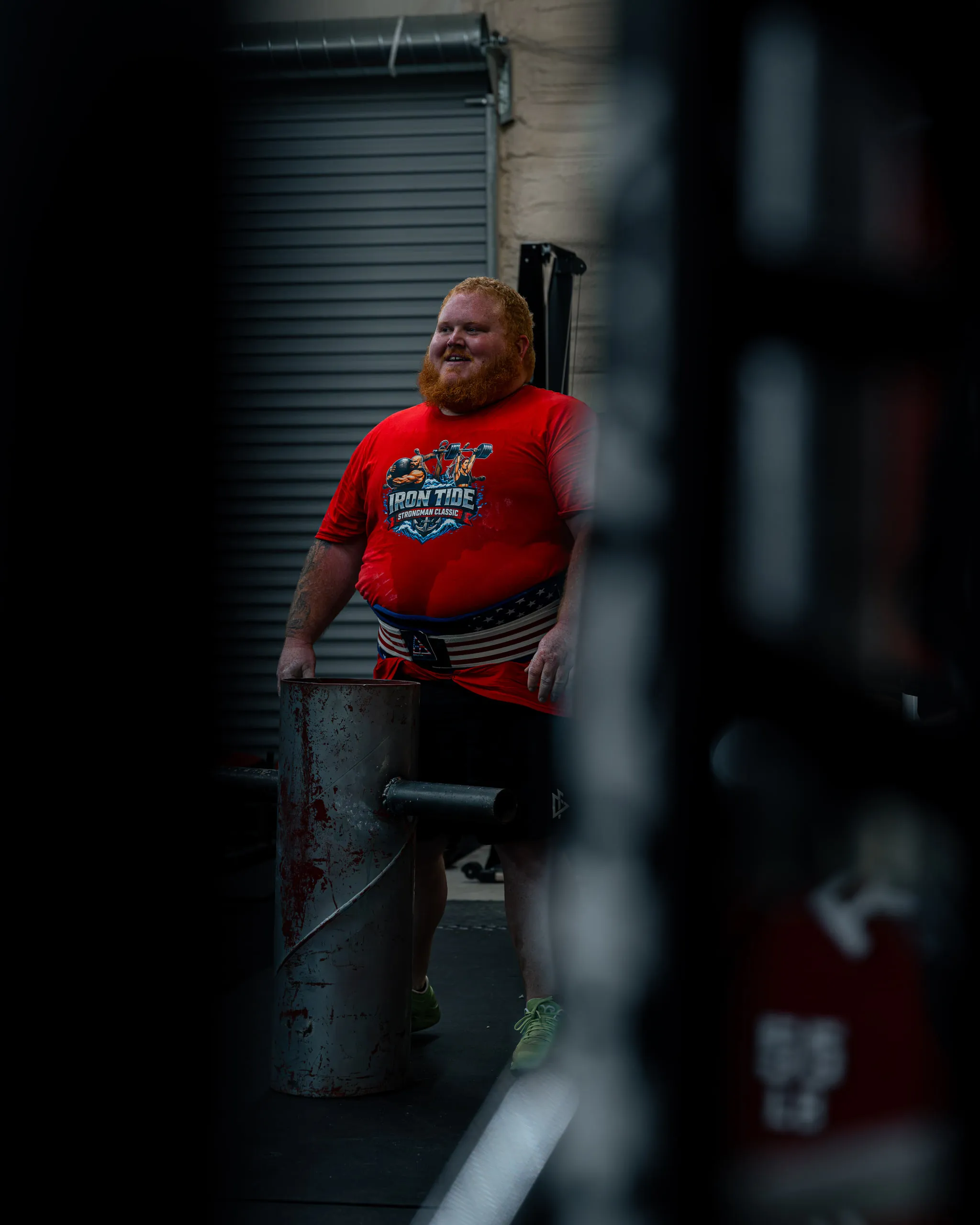 A red-bearded competitor catches his breath in a doorway between events